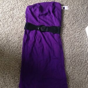 Purple dress! With a black belt and has no straps.