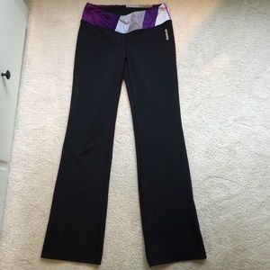 Black reebok yoga pants with purple band