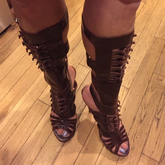 Brown heeled boots with buckle up straps