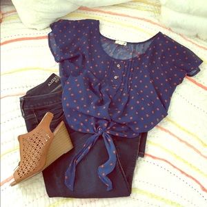 Navy and orange polka-dot blouse