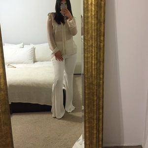 Sheer ivory blouse. NEVER WORN