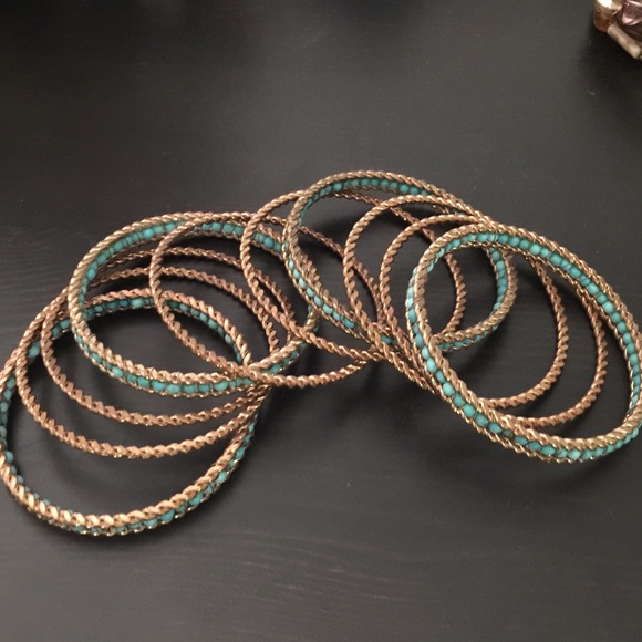 Teal and gold bangles, bracelets.