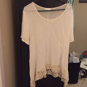 2X asymmetric cream top with lace bottom.