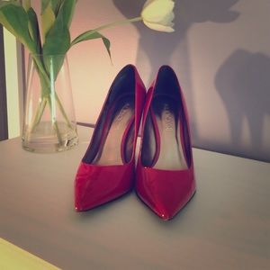 Aldo red patent leather pumps.