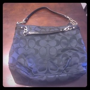 Black bucket style coach purse