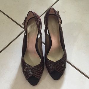 Peep to brown snakeskin heels