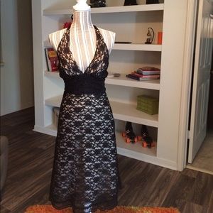 Backless black lace dress.