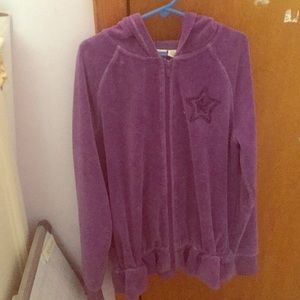 This is a purple child's hoodie.
