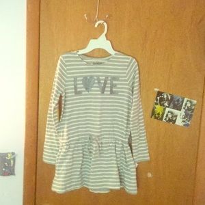 A girls dress( wear something under) Brand new