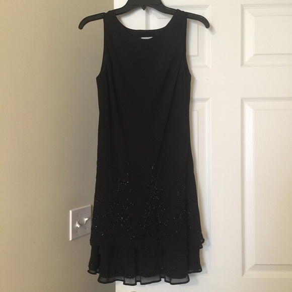 Beautiful beaded hem line drop waist black dress