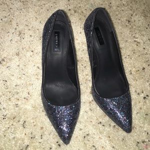 Black sparkly high heels.