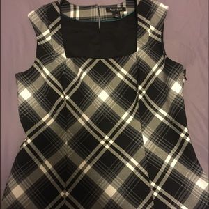 Black white and grey sleeveless top with side zip