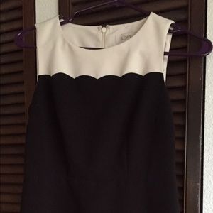 White & ivory dress with scallop bottom.