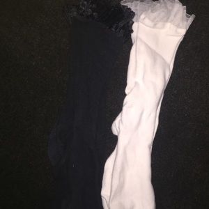 2 pairs of socks. Black and white with frilly edge
