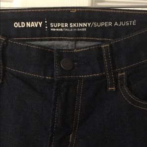 Old navy dark blue mid rise super skinny size 2