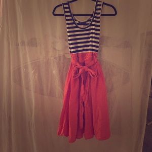 Dress with a striped top and coral skirt.
