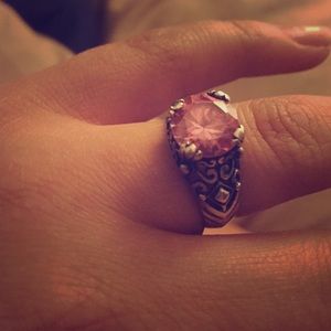 Sterling silver ring with a pink stone.
