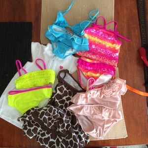 2 girls bathing suits and cover up