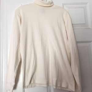 A light off white turtle neck.