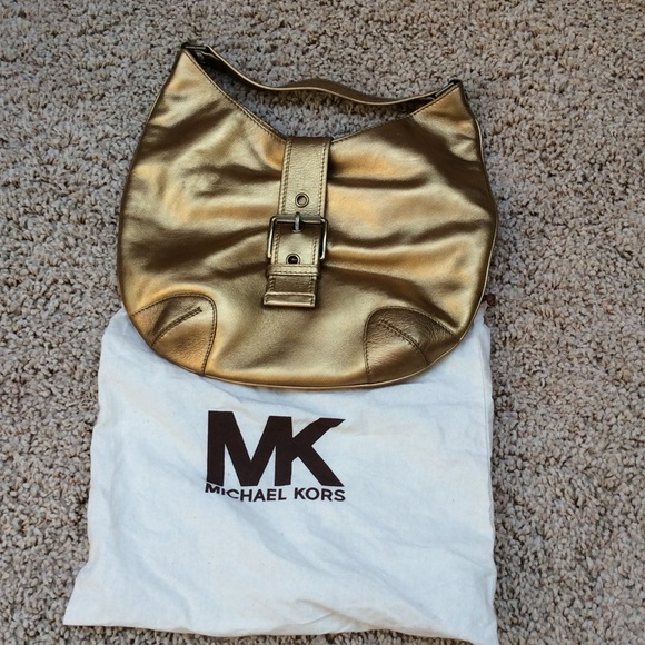 Michael Kors gold leather handbag.