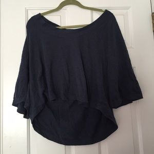 A cool, cut off, gray sweater material shirt.
