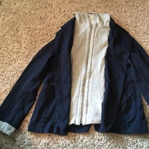 Blue blazer with grey zip-up face.