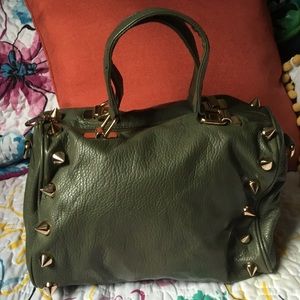 Green purse with spikes