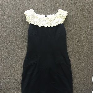 Black dress with pockets and flower neckline
