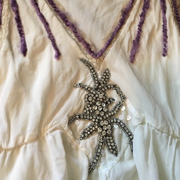 Creme' blouse with intricate crystal detailing.