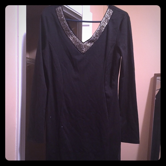 black dress with silver jewelry around neck