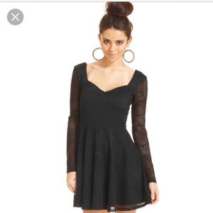Mini black dress with sleeves