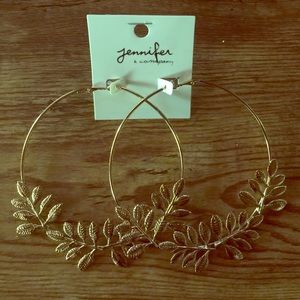 Large gold tone hoops.