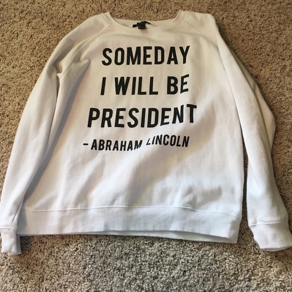 White with black print sweatshirt.