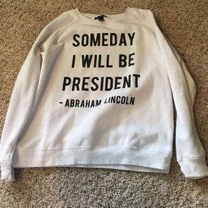 White with black print sweatshirt.