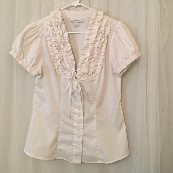 White button up blouse with ruffles.