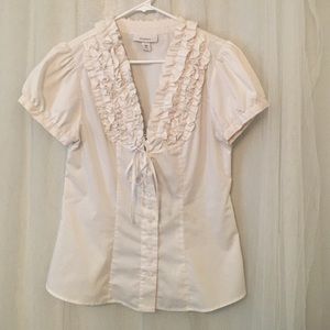 White button up blouse with ruffles.