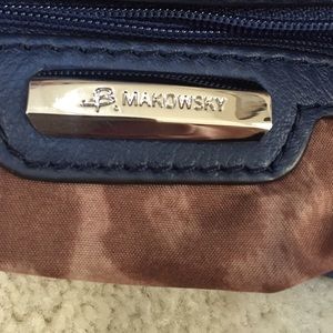 B. Makowsky blue and black bucket bag
