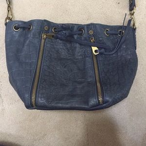 Joelle Hawkens draw string cross body bag