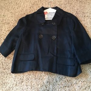 Navy blue cropped jacket with 3/4 sleeves.