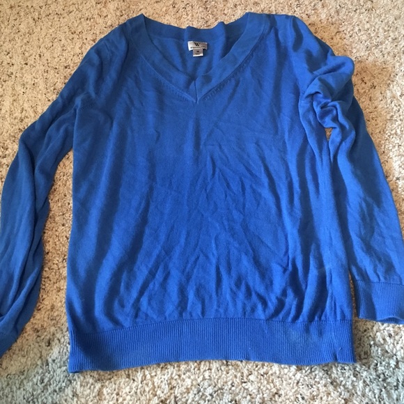 Blue v-neck sweater.