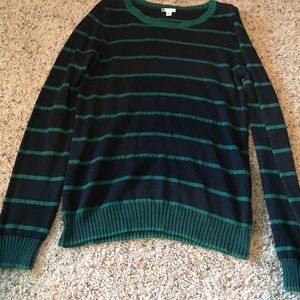 Striped blue and green sweater.