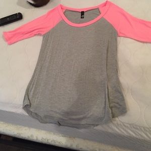Quarter length grey shirt with neon pink sleeves
