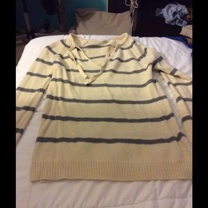A cream and grey striped sweater