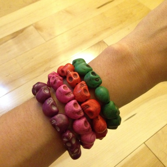 Green, orange, pink, purple skull bracelets