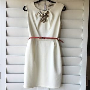 White fitted dress with red belt