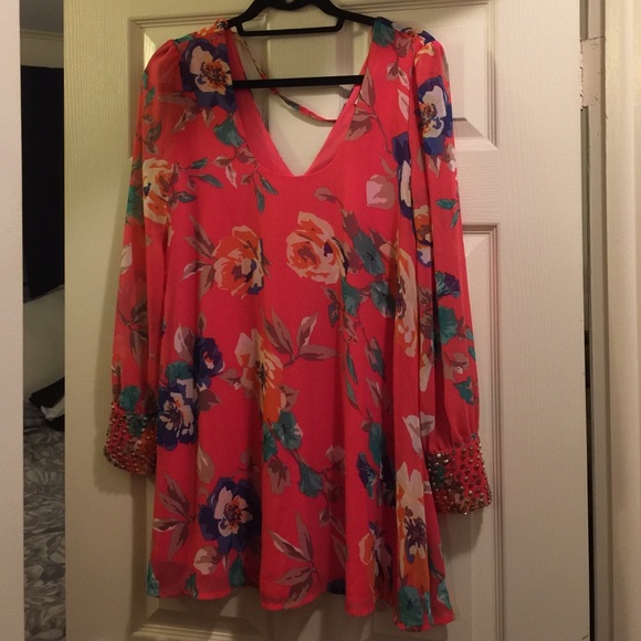 Floral mini dress with embellished cuffs!