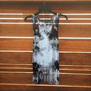 Tie-dye tank top with fringe.