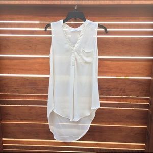 Cream semi-sheer blouse.