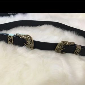 Double buckle belt.