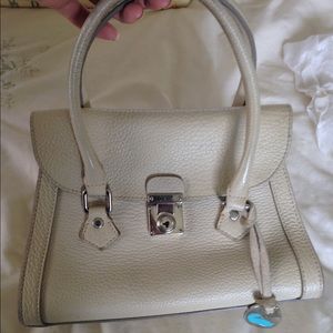 Dooney and Bourke mini leather purse w/key closure